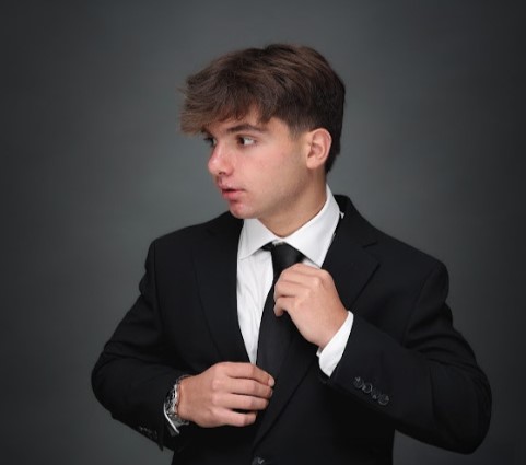 Teen entrepreneur Michael Satterlee earns £15k a month selling shoe charms while balancing school, reinvesting profits, and planning future 3D printing ventures.