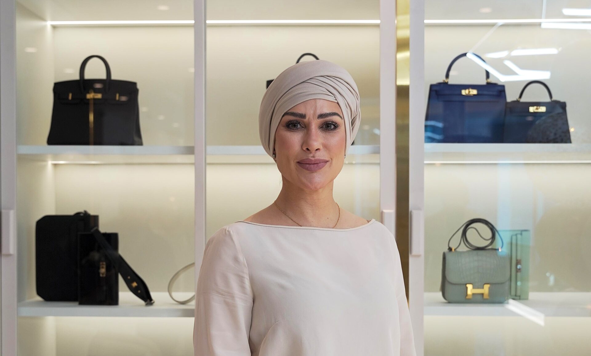 Luxury resale expert Emily Abraham, who has sold over £50m in designer bags, warns fakes are rising online and urges buyers to check stitching, hardware, smell and only trust professionals.