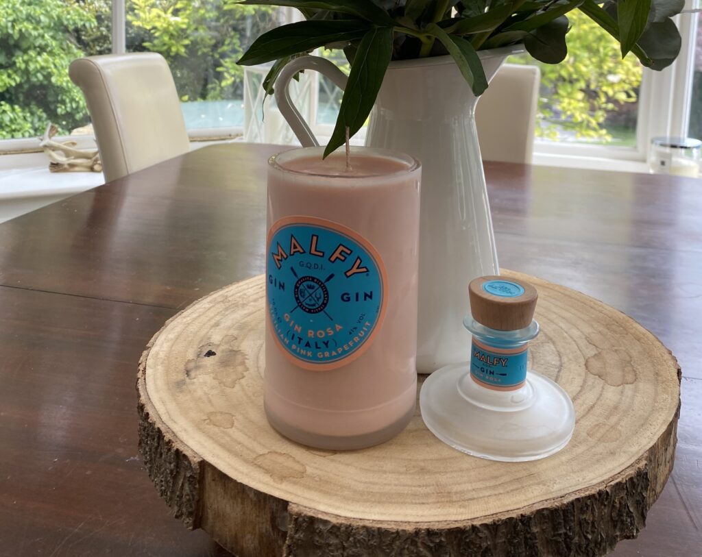 A woman who lost her job turned leftover bottles into luxury candles launching a kitchen table side hustle that grew to £5,000 a month and even £8,000 profit at Christmas transforming her career.